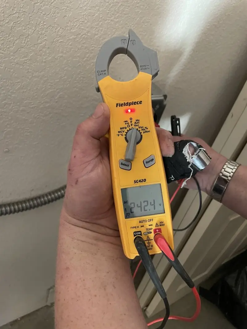 Voltage testing with clamp meter during Recessed Lighting Installation in Biddeford